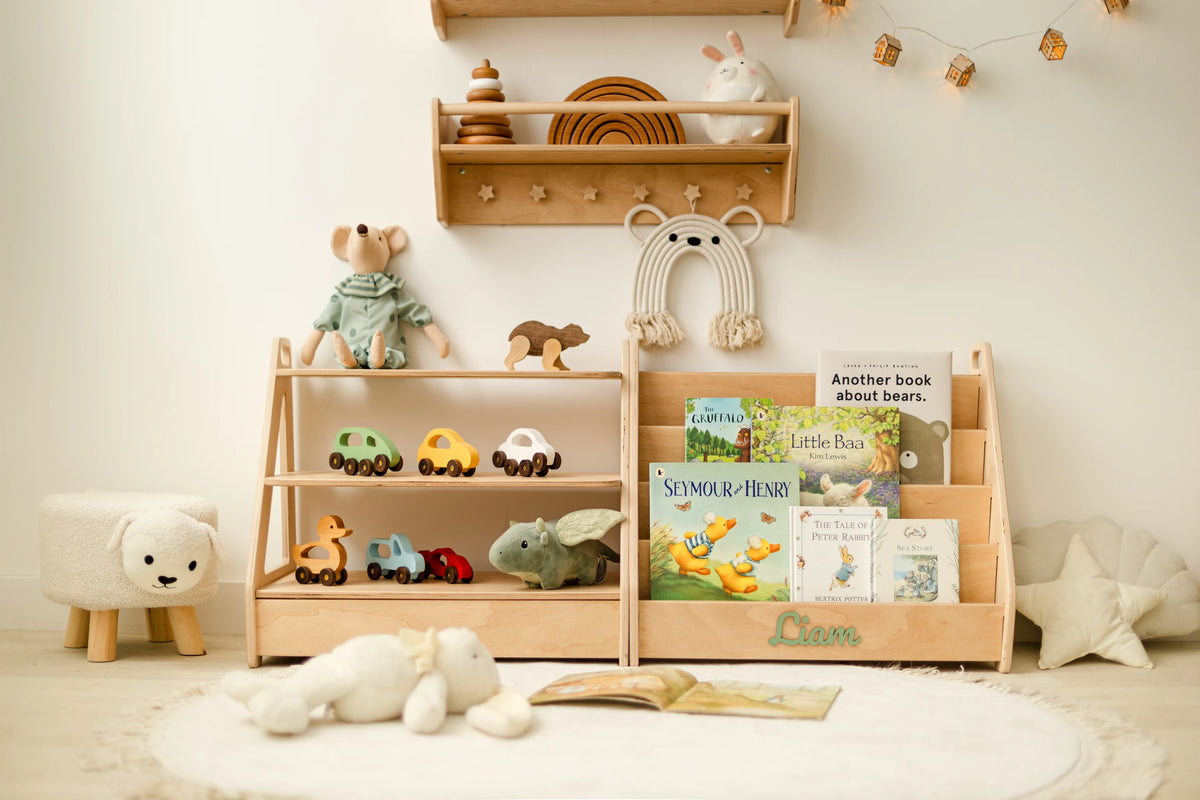 Light wood Montessori toy shelf and front-facing bookshelf set styled in a nursery with a wall shelf, toys and books