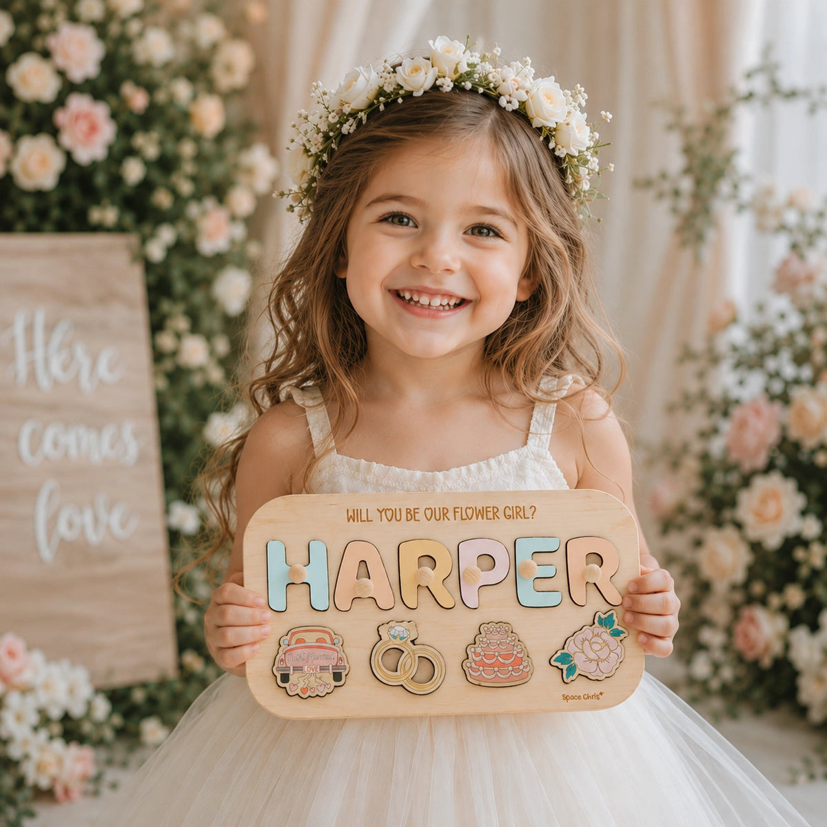 Flower girl holding her personalized Harper proposal puzzle
