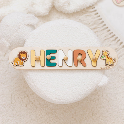 Name puzzle with the name Henry, a lion and a giraffe side element on a soft cushion