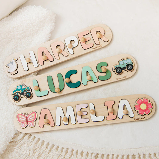 Three wooden name puzzles with the names Harper, Lucas and Amelia in colorful lift-out letters with animal and flower pieces