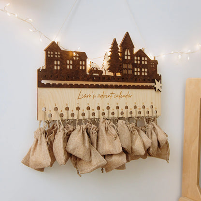 Small personalized wooden City advent calendar with burlap countdown bags