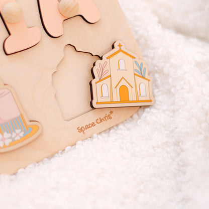 Close-up of church-shaped piece on personalized baptism puzzle