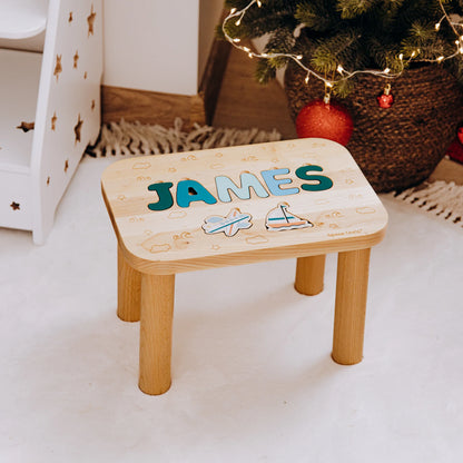 Custom wooden toddler step stool featuring the name James and printed Ocean theme elements near a Christmas tree.