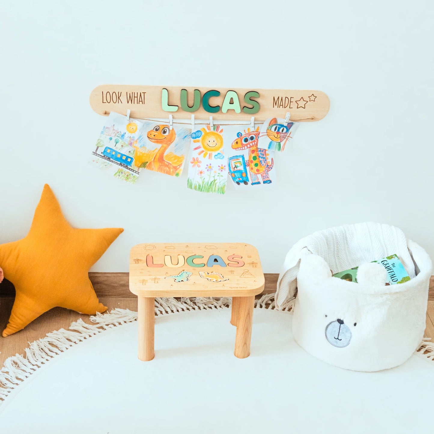 Look What I Made display with the name Lucas and colorful animal pieces above a toy basket and star cushion