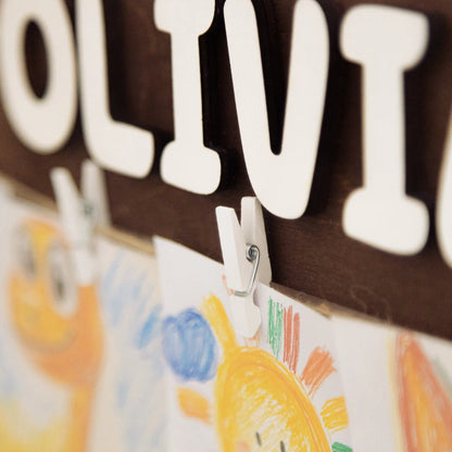 Close-up of large white 3D letters spelling Olivia on a Look What I Made art display
