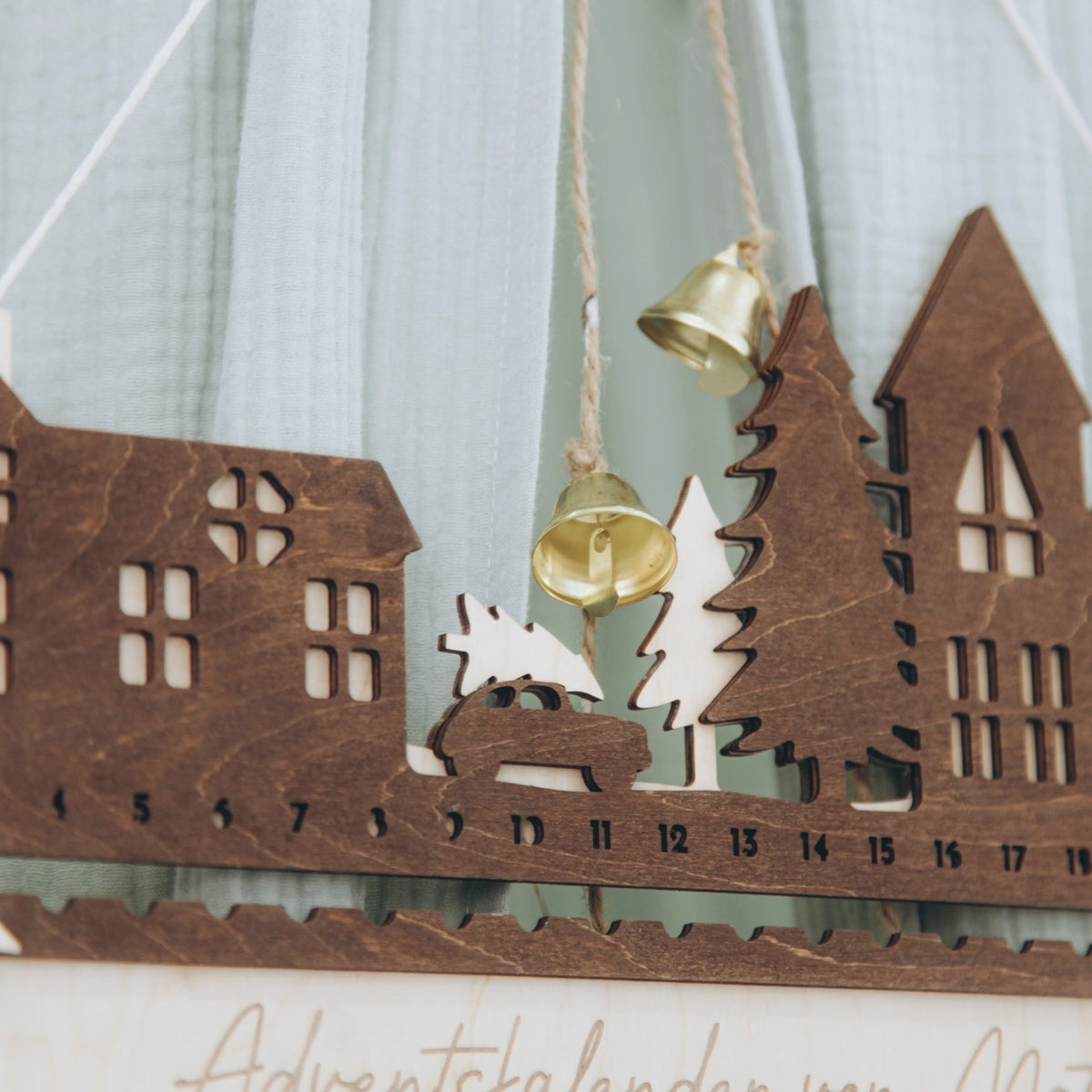 Wooden City advent calendar with house and tree silhouettes and personalized name