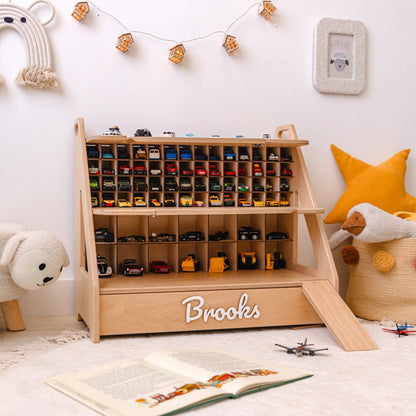 Light wood personalized car garage with the name Brooks in a decorated kids room