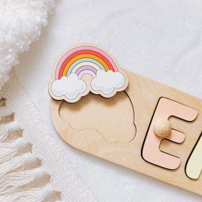 Name puzzle with the name and a rainbow side element on a fringed blanket