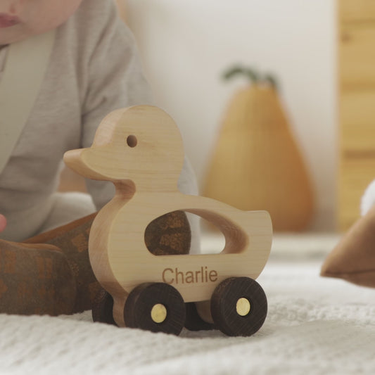 Video of personalized light wood duck push toy with name Charlie